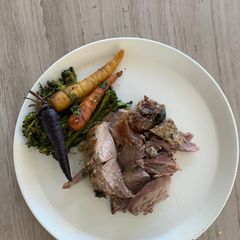 A picture of Steamed veggies and Roast Lamb.