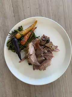 A picture of Steamed veggies and Roast Lamb.