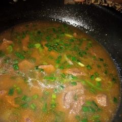 A picture of Beef chili with gravy.