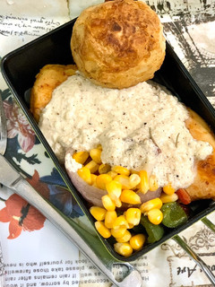 A picture of Chicken Steak with black pepper sauce and stir fried vegetables.