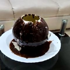 Walnut brownie ice cream stuffed melting ball dessert A picture of Walnut brownie ice cream stuffed melting ball dessert.