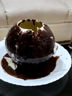 A picture of Walnut brownie ice cream stuffed melting ball dessert.