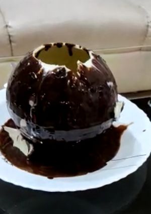 A picture of Walnut brownie ice cream stuffed melting ball dessert.