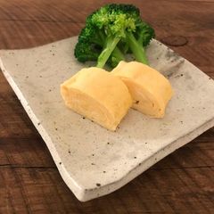 A picture of Dashimaki Tamago (Japanese style fluffy egg omelette) - Tamagoyaki.