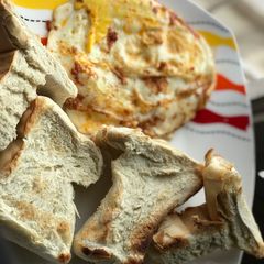 Agege toasties and pepper smeared sunny side up A picture of Agege toasties and pepper smeared sunny side up.