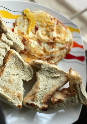 A picture of Agege toasties and pepper smeared sunny side up.