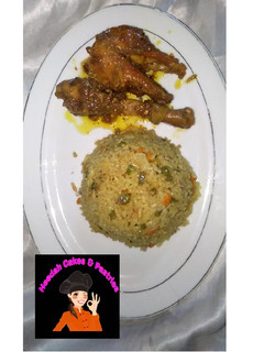 A picture of Fried rice and peppered chiken.