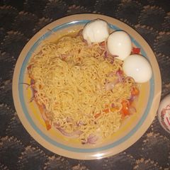 A picture of Onions Noodles with Hard Boiled Eggs.