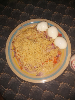 A picture of Onions Noodles with Hard Boiled Eggs.