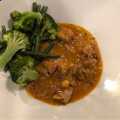 A picture of Mackerel Thai Red Curry.