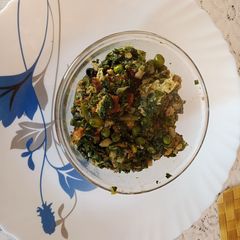 A picture of Saag with egg fry.
