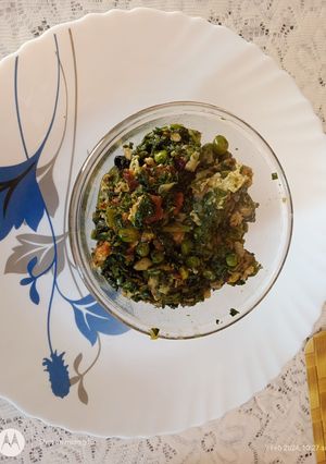 A picture of Saag with egg fry.