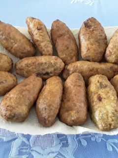 Una foto de Croquetas de chipirones en su tinta