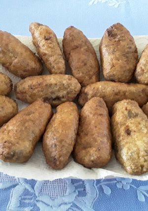 Una foto de Croquetas de chipirones en su tinta