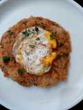 Crispy pattie with leftover bread crumbs top with fried egg