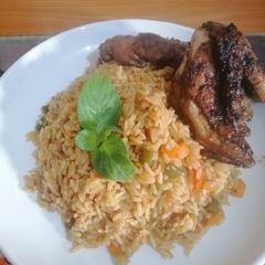 A picture of Fried Rice with Grilled chicken.