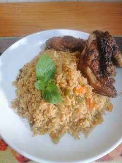 A picture of Fried Rice with Grilled chicken.