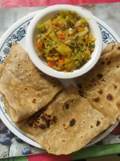 A picture of Chapati and cabbage curry.