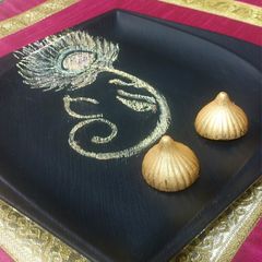 A picture of Golden Glory Dry Fruit Chocolate modak.