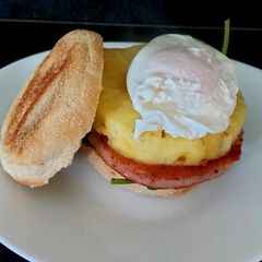 A picture of My Muffin with Gammon, Pineapple + Poached Egg on Spinach.