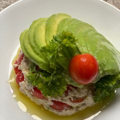 A picture of Cheese & tomatoes in avocado blanket.