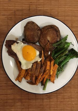 A picture of Bavette steak. Soy portobello mushrooms, sweet potato and greens.