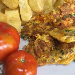 A picture of Fried sweet potatoes with fried eggs.