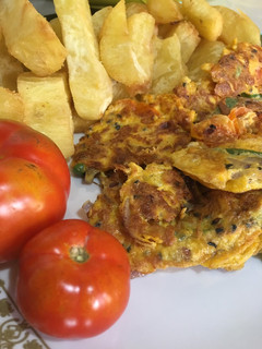 A picture of Fried sweet potatoes with fried eggs.