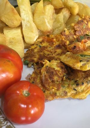 A picture of Fried sweet potatoes with fried eggs.