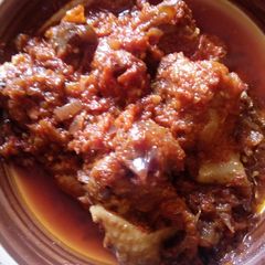 A picture of Gizzard sauce with Basmati rice.