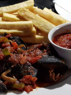 A picture of Fried yam with peppered snail.