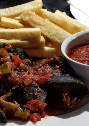 A picture of Fried yam with peppered snail.