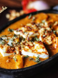 A picture of Paneer Makhani/ cottage cheese in tomato gravy.