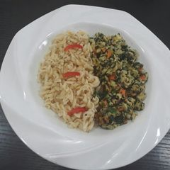 A picture of Pasta with fried egg.
