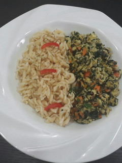 A picture of Pasta with fried egg.