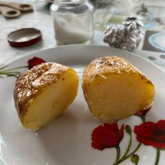 A picture of Potatoes in the embers.