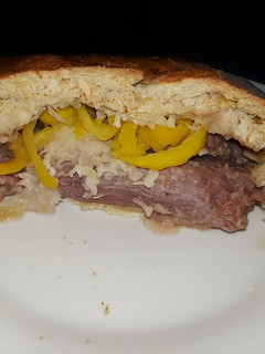A picture of Stuffed corned beef in pretzel bread.