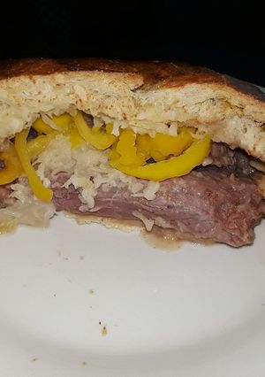 A picture of Stuffed corned beef in pretzel bread.