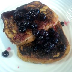 A picture of French Toast with blueberries compote.