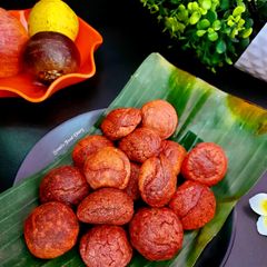 A picture of Paniyaram / Appam with Fruit and Vegetable Peels.