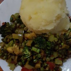 African mashed potatoes served with mixed Veges A picture of African mashed potatoes served with mixed Veges.