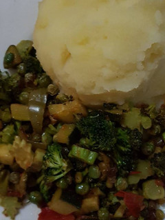 A picture of African mashed potatoes served with mixed Veges.