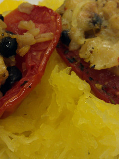 A picture of Stuffed tomatoes with brown rice.