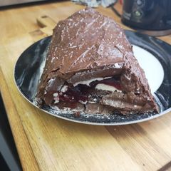 A picture of Chocolate Mousse Covered Black Forest Roulade.