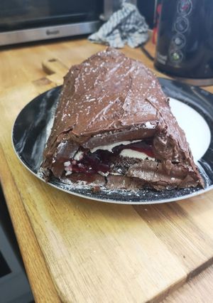 A picture of Chocolate Mousse Covered Black Forest Roulade.