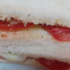 A picture of Tomato and cucumber sandwich.