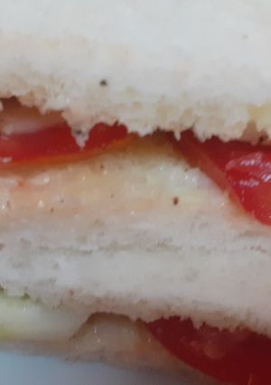 A picture of Tomato and cucumber sandwich.