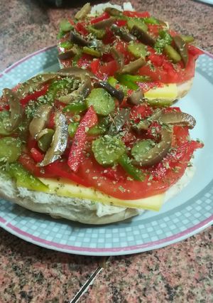 Una foto de Pizza en marraqueta