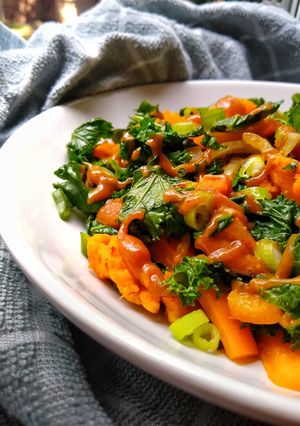 A picture of Sweet Potato & Kale Stir Fry With A Peanut Sesame Dressing.