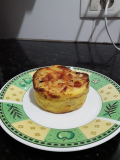 Una foto de Mini soufflé de cebolla y queso